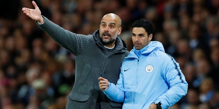 Pep Guardiola and Mikel Arteta on the touchline at Manchester City