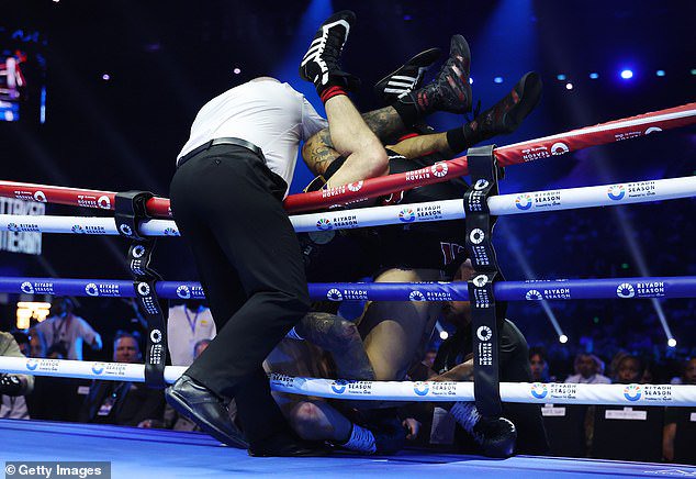 Both fighters had toppled up and over the ropes, leaving Whittaker requiring a wheelchair