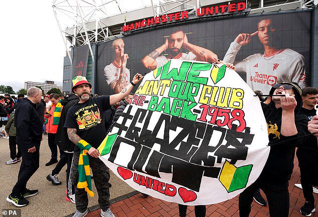 The group are pictured at one of their protests on the opening day of last season in August