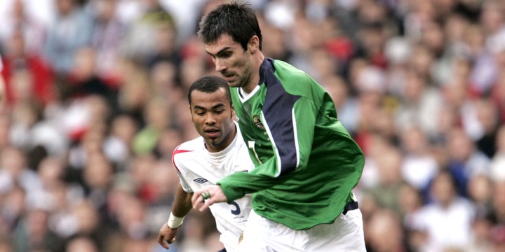 Keith Gillespie - Northern Ireland in action against Ashley Cole - England