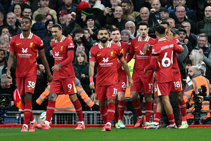 Liverpool's English midfielder #17 Curtis Jones (3R) celebrates scoring the team's second goal during the English Premier League football match bet...