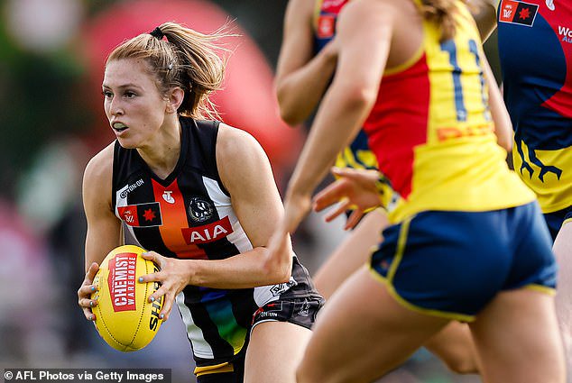 Footy legend Dale Thomas says the new footballs feel exactly the same - except they need to be charged before a match (pictured, a smart ball being used in Collingwood's round eight match against Adelaide last weekend)