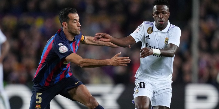 Sergio Busquets and Vinicius Jr during Barcelona vs Real Madrid.