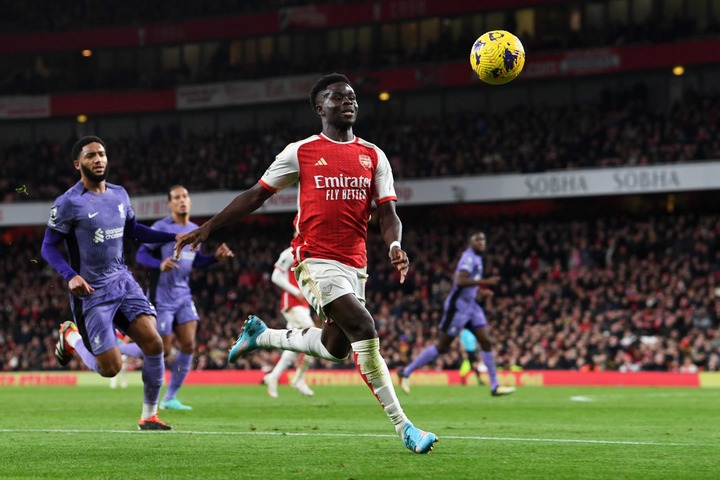 Bukayo Saka of Arsenal chases a loose ball during the Premier League match between Arsenal FC and Liverpool FC at Emirates Stadium on February 04, ...