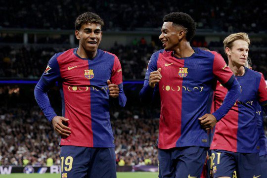 Lamine Yamal of FC Barcelona celebrates 0-3 with Alejandro Balde of FC Barcelonaduring the LaLiga EA Sportsmatch between Real Madrid v FC Barcelona at the Estadio Santiago Bernabeu