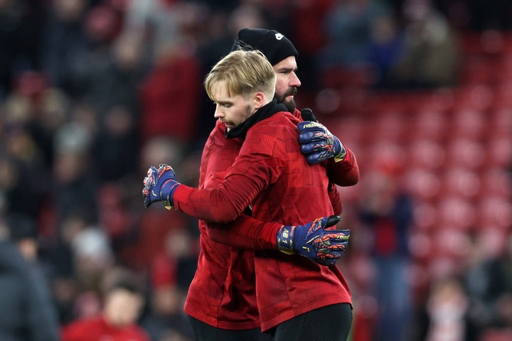 Alisson Becker of Liverpool and Caoimhin Kelleher of Liverpool interact prior to the Carabao Cup Semi Final First Leg match between Liverpool and F...