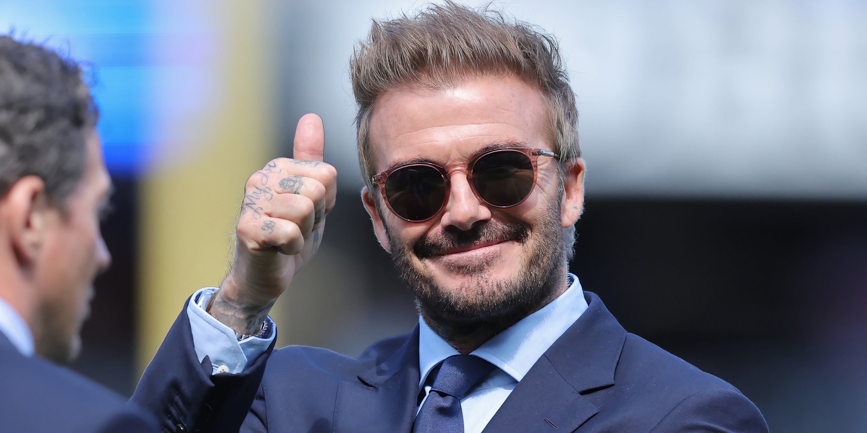 David Beckham gives a thumbs up to the crowd at an Inter Miami game