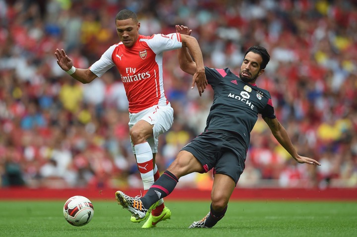 Kieran Gibbs of Arsenal in action with Ruben Amorim of Benfica during the Emirates Cup match between Arsenal and Benfica at the Emirates Stadium on...