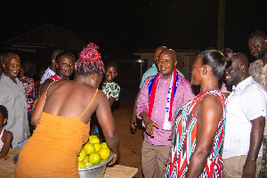 Stephen Ntim interacting with some people during a campaign