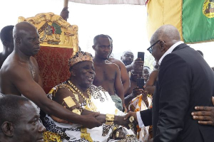 President Akufo-Addo (in suit) exchanging pleasantries with the Okyenehene