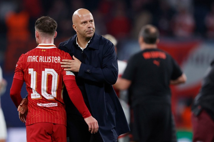 (L-R) Alexis Mac Allister of Liverpool, coach Arne Slot of Liverpool after the match during the UEFA Champions League  match between RB Leipzig v L...