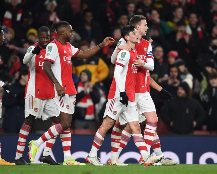 (2ndR) Charlie Patino celebrates scoring the 5th Arsenal goal with (R) Rob Holding and (R) Nuno Tavares during the Carabao Cup Quarter Final match ...