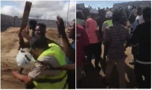 Residents of Buduburam manhandling two Chinese contractors