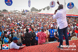 Dr Mahamudu Bawumia, cheering on supporters at a rally