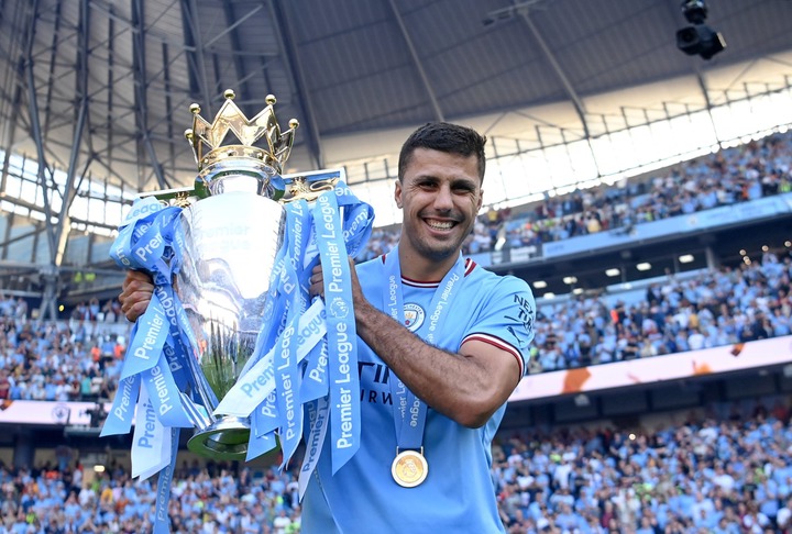 Rodri of Manchester City poses for a photograph with the Premier League Trophy following the Premier League match between Manchester City and Chels...