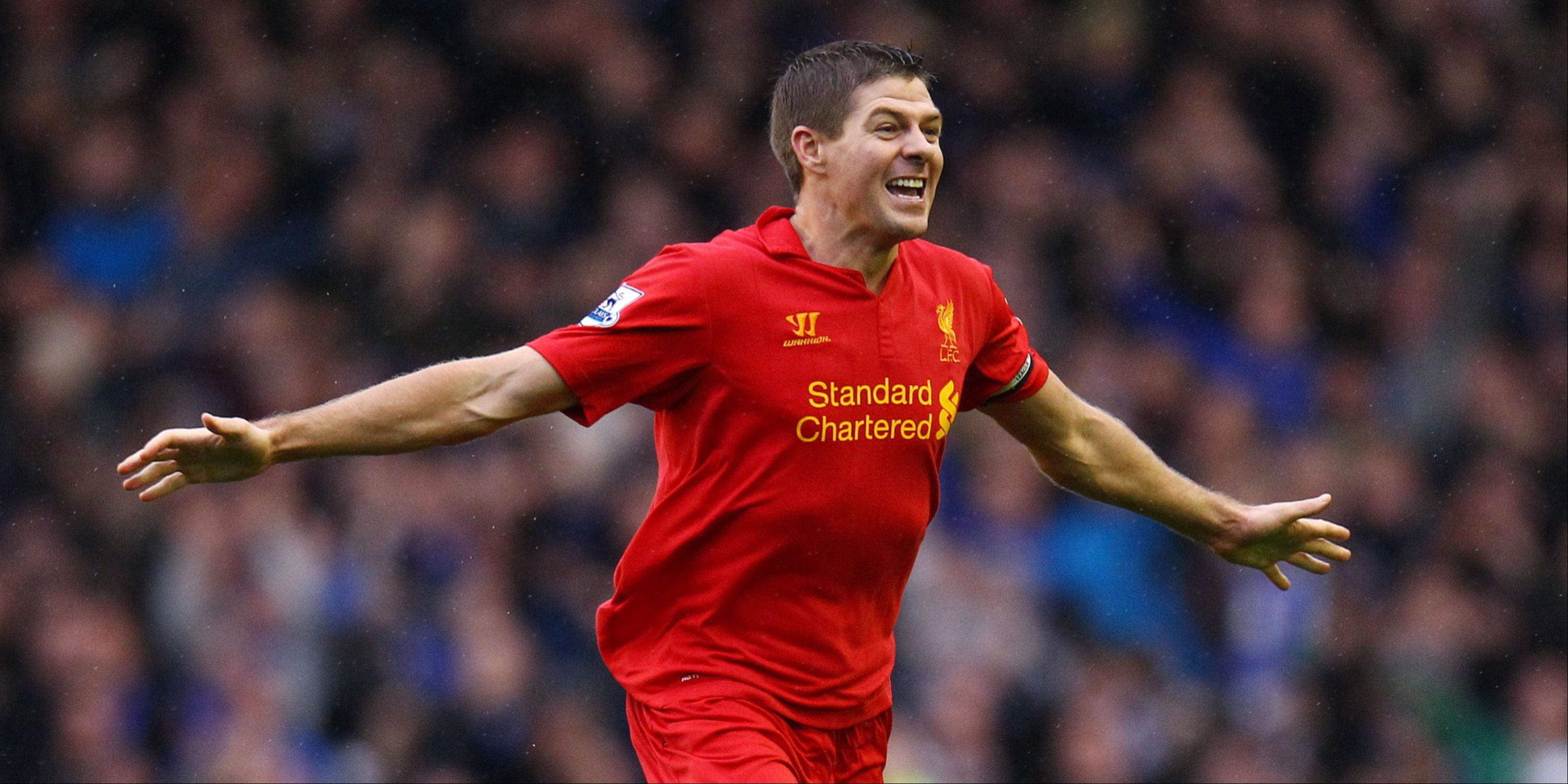 An old Steven Gerrard celebrates scoring for Liverpool against Everton. 