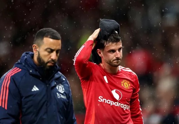 Mason Mount walks off the Old Trafford pitch holding a towel on his head after a head injury.