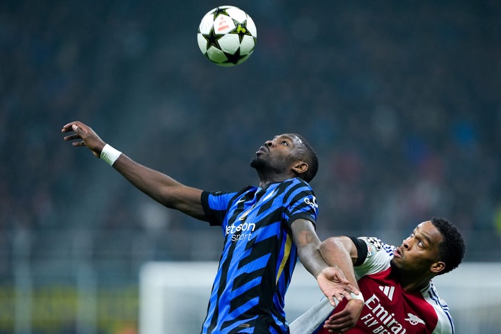 Jurrien Timber of Arsenal and Marcus Thuram of FC Internazionale jump for the ball during the UEFA Champions League 2024/25 League Phase MD4 match ...