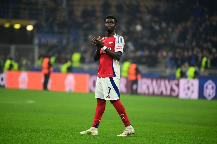 Bukayo Saka of Arsenal FC  cheers fans at the end of the UEFA Champions League football match Inter Milan and Arsenal FC at San Siro Stadium in Mil...