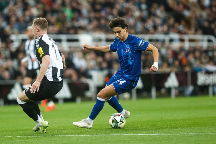 Joao Felix of Chelsea (R) dribbles Emil Krafth of Newcastle United (L) during the Carabao Cup Fourth Round match between Newcastle United and Chels...