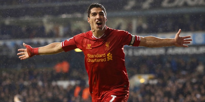 Luis Suarez celebrates scoring for Liverpool.