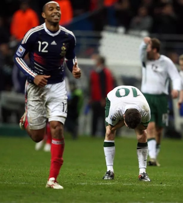 A smirking Thierry Henry peels away following his blatant handball at Stade de France