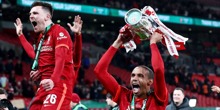 Liverpool's Andy Robertson and Joel Matip celebrate with the Carabao Cup.