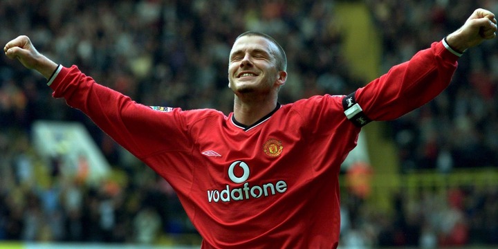 Manchester United's David Beckham celebrates after scoring the fifth goal against Tottenham Hotspur