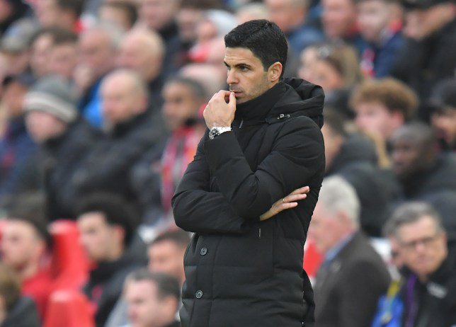 Mikel Arteta is seen watching his Arsenal team play against Liverpool during a Premier League game at Anfield