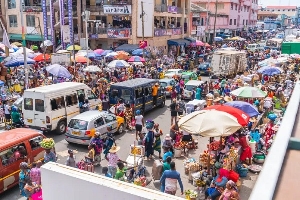 A photo capturing both traders and buyers at Makola