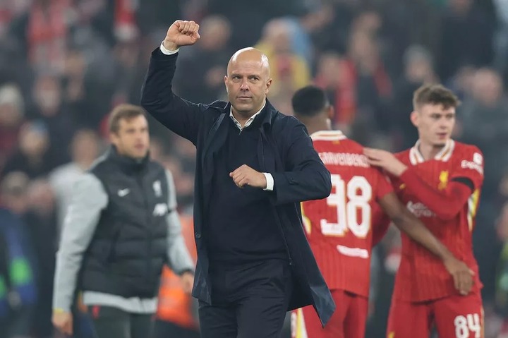 Arne Slot celebrates Liverpool's victory over Bayer Leverkusen in the Champions League