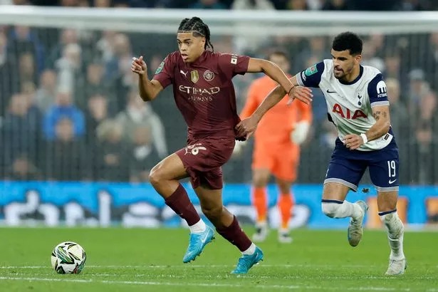 LONDON, ENGLAND - OCTOBER 30: Jahmai Simpson-Pusey of Manchester City and Dominic Solanke of Tottenham Hotspur challenge during the Carabao Cup Fourth Round match between Tottenham Hotspur and Manchester City at Tottenham Hotspur Stadium on October 30, 2024 in London, England. (Photo by Nigel French/Sportsphoto/Allstar via Getty Images)