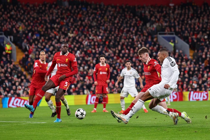 Conor Bradley of Liverpool and Kylian Mbappe of Real Madrid during the UEFA Champions League 2024/25 League Phase MD5 match between Liverpool FC an...