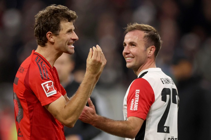 Thomas Mueller and Mario Goetze of Eintracht Frankfurt interact following the Bundesliga match between Eintracht Frankfurt and FC Bayern München at...