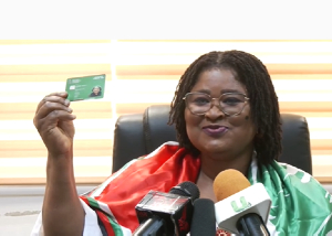 Gifty Klenam displaying her NDC membership card