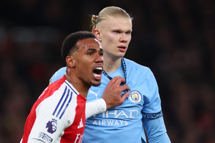 Erling Haaland of Manchester City tangles with Gabriel Magalhaes of Arsenal during the Premier League match between Arsenal FC and Manchester City ...