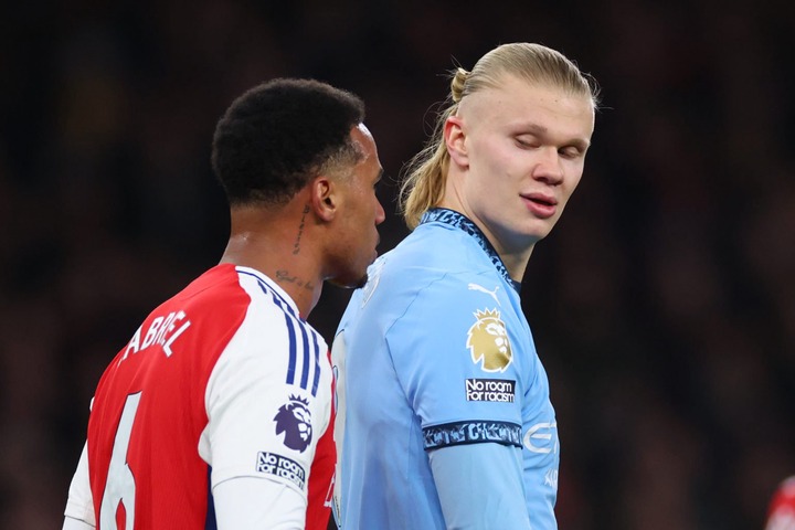 Gabriel Magalhaes of Arsenal tangles with Erling Haaland of Manchester City during the Premier League match between Arsenal FC and Manchester City ...