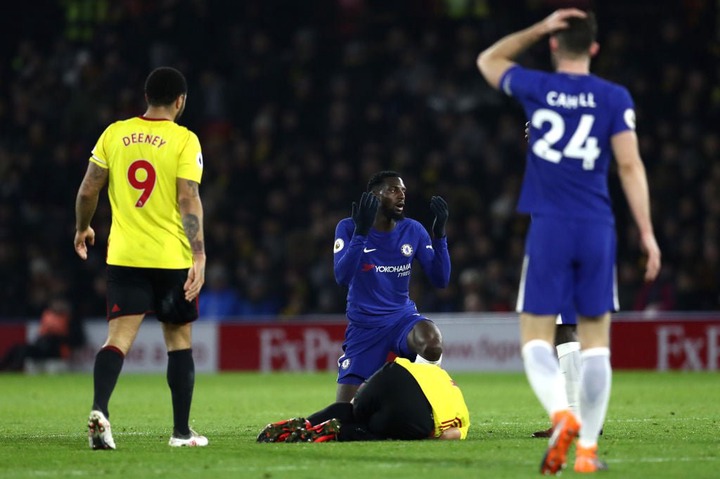 Tiemoue Bakayoko of Chelsea reacts to a tackle on Richarlison de Andrade of Watford during the Premier League match between Watford and Chelsea at ...