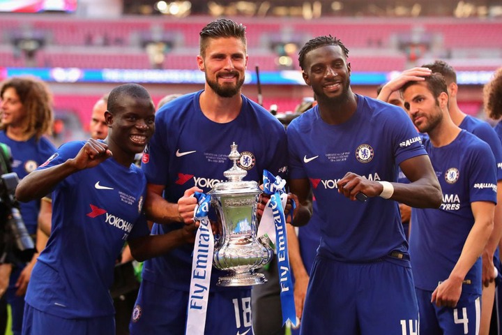 N'Golo Kante, Olivier Giroud and Tiemoue Bakayoko, all of Chelsea, celebrate with the FA Cup trophy after the Emirates FA Cup Final between Chelsea...