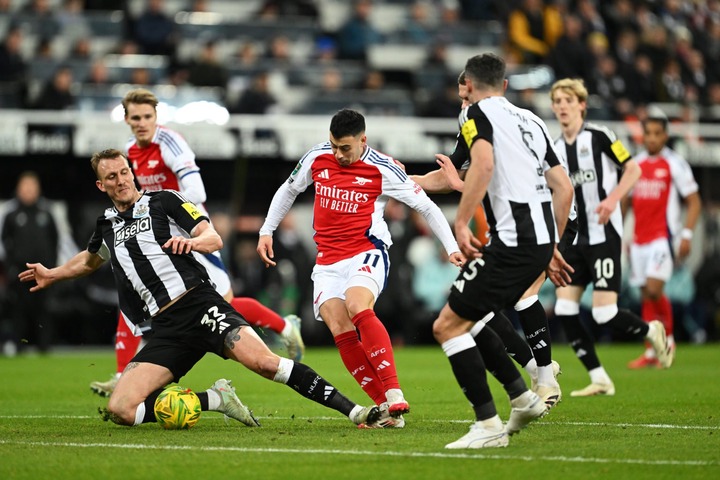 Gabriel Martinelli of Arsenal is fouled by Dan Burn of Newcastle United during the Carabao Cup Semi Final Second Leg match between Newcastle United...