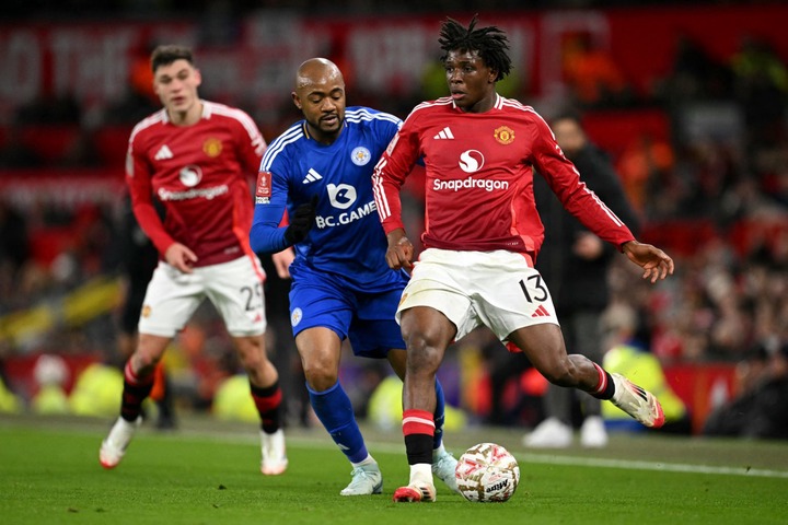 Manchester United's Danish defender #13 Patrick Dorgu battles for the ball with Leicester City's French-born Ghanaian striker #18 Jordan Ayew durin...