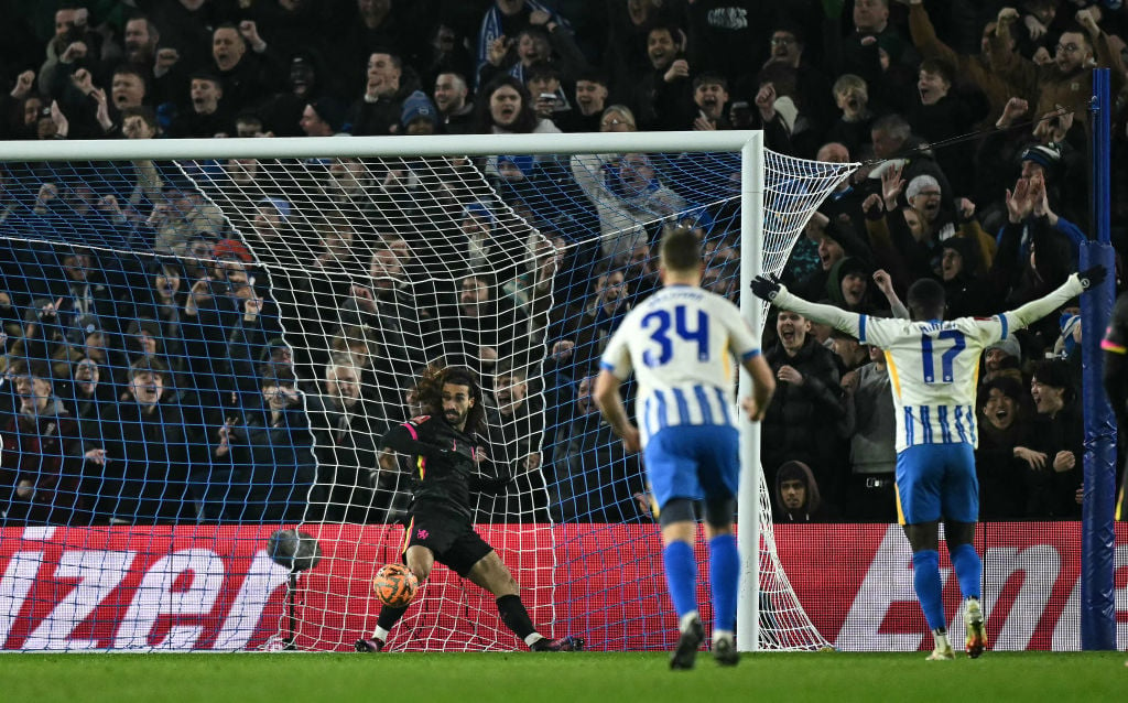 Chelsea's Spanish defender #03 Marc Cucurella (L) crashes into the net after running into the goal in a failed attempt to save the header of Bright...