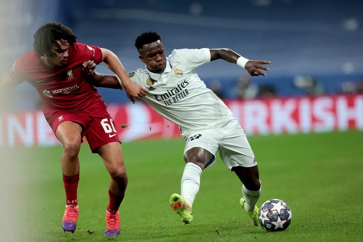 Real Madrid player Vinicius Jr. (R) and Liverpool player Alexander-Arnold (L) Real Madrid vs. Liverpool round of 16 match day 2 of 2 in the Champions League. Santiago Bernabeu Stadium in the capital of the Kingdom of Spain