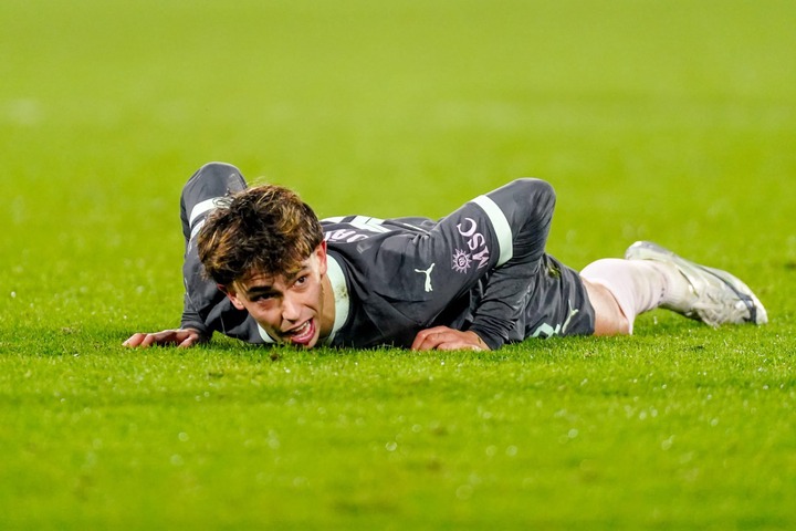 Joao Felix of AC Milan laying on the pitch and looks exhausted and dejected during the UEFA Champions League 2024/25 League Knockout Play-off First...