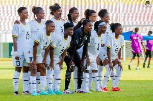 Players of the Black Queens pose for a picture before the game