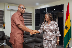 Minister of Trade, Agribusiness, and Industry, Elizabeth Ofosu- Adjare and GIPC CEO in a handshake