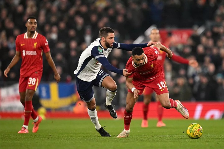 Tottenham Hotspur's Uruguayan midfielder #30 Rodrigo Bentancur battles for the ball with Liverpool's Dutch striker #18 Cody Gakpo during the English League Cup semi-final second leg football match between Liverpool and Tottenham Hotspur at Anfield in Liverpool, north west England on February 6, 2025. (Photo by Oli SCARFF / AFP) / RESTRICTED TO EDITORIAL USE. No use with unauthorized audio, video, data, fixture lists, club/league logos or 'live' services. Online in-match use limited to 120 images. An additional 40 images may be used in extra time. No video emulation. Social media in-match use limited to 120 images. An additional 40 images may be used in extra time. No use in betting publications, games or single club/league/player publications. / (Photo by OLI SCARFF/AFP via Getty Images)