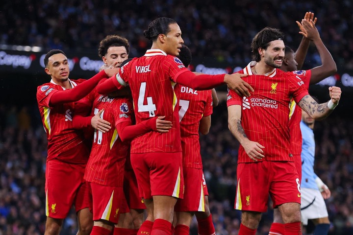 Liverpool players celebrate their side's first goal