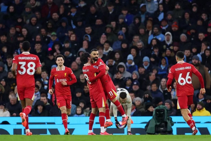 Dominik Szoboszlai celebrates with Mohamed Salah during Liverpool's Premier League clash against Man City