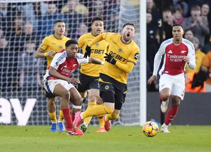 Arsenal's Myles Lewis-Skelly fouls Wolverhampton Wanderers' Matt Doherty